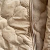 Enterito astronauta beige de bebé | Tienda Olivia