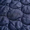 Campera de matelassé azul con capucha | Tienda Olivia Uruguay